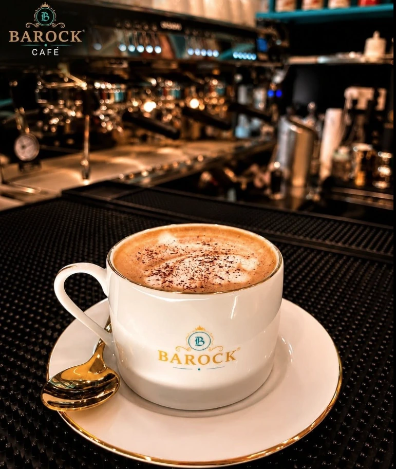 BAROCK white coffee cup and gold spoon at the espresso machine